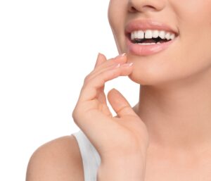 Close-up view of a woman's smile, displaying a gap between her two front teeth